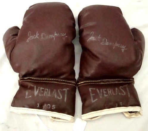 Pair of Vintage Jack Dempsey Model Youth Boxing Glo: Pair of Vintage Everlast #1705 Jack Dempsey Model Youth Boxing Gloves; brown leather youth boxing gloves with Jack Dempsey facsimile signatures on the top of each glove; lettering is slightly faded, b