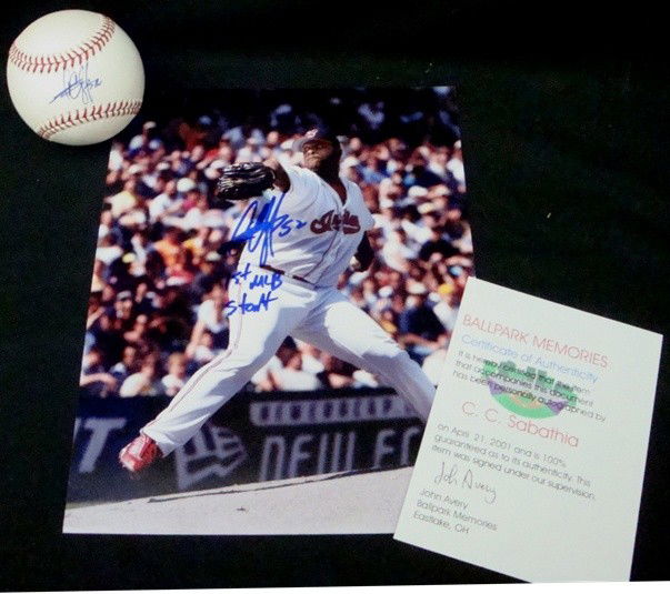 CC Sabathia Autographed Ball & Photo: CC Sabathia Autographed Lot; comes with a full color 8x10 signed by Sabathia in blue marker and '1st MLB Start' inscription; also comes with an Official MLB Bud Selig ball signed on the sweet spot in