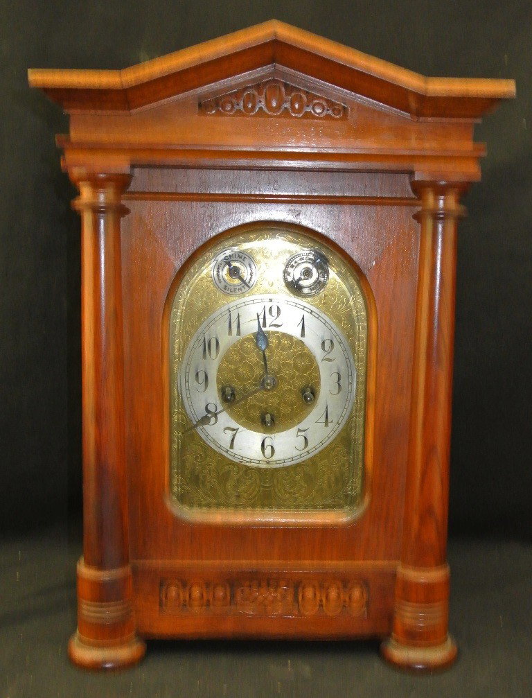 Unghans German Bracket Clock: Beautifully encased in mahogany that measures 18x12.75x8.5". Excellent working condition.