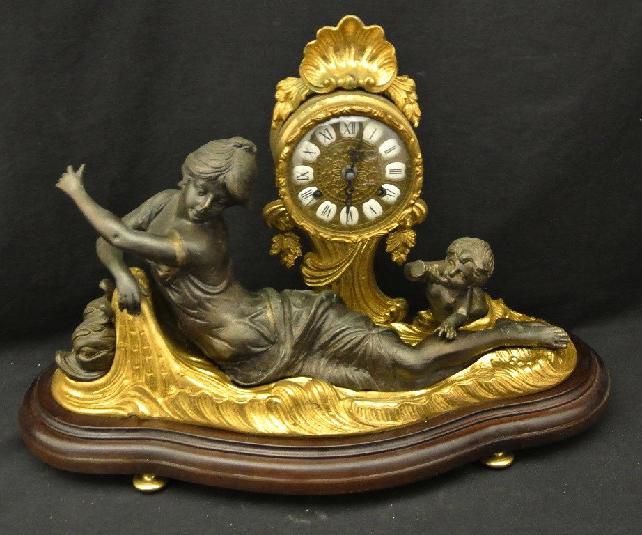 German Mid 20th c. Nouveau Style Mantle Clock: 14x22x10" brass and patinated metal nouveau style mantle clock. Maiden, cherub and dolphins. Needs a good cleaning, otherwise an exceptional lamp.