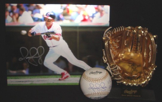 Omar Vizquel Autographed Gold Glove Lot: Omar Vizquel Autographed Gold Glove Lot; nice lot of (3) autographed items; includes Official Rawlings Gold Glove Baseball signed by Vizquel on the sweet spot in blue ink with '11X GG' inscription; be