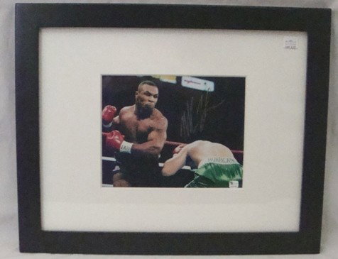 Mike Tyson Autographed 8x10 Framed Photo: Mike Tyson Autographed 8x10 Full Color Matted & Framed Photo; signed in silver sharpie marker; shows fight with Peter 'Hurricane' McNeeley dated Aug 19th, 1995 at the MGM Grand in Las Vegas; measures 