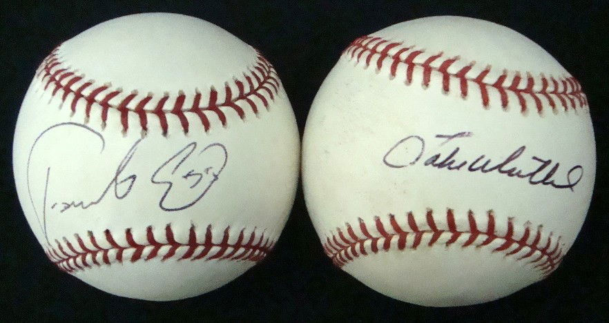 Fausto Carmona Jake Westbrook Signed Baseballs: Lot of (2) Autographed Baseballs; includes a Fausto Carmona autographed Official ML Bud Selig baseball signed on the sweet spot in blue ink with '55' inscription; also includes a Jake Westbrook autogr