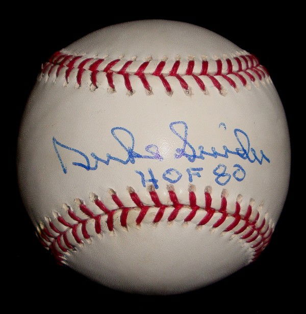 Duke Snider Autographed Baseball: Official MLB Bud Selig Baseball signed by Duke Snider on the sweet spot in blue ballpoint pen with 'HOF 80' inscription; great signature by the former Brooklyn Dodger.