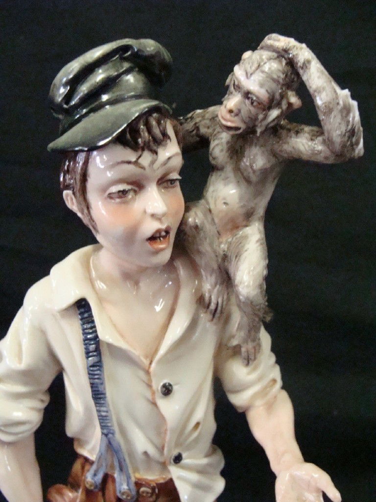 Works of Art Italy Organ Grinder Figurine: He Stands 12" tall to the top of the monkey on his shoulder.