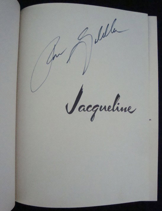 1974 Jacqueline by Ron Galella, Signed: Jacqueline by Ron Galella, Photographer; Sheed and Ward, Inc., New York, 1974; signed by photographer on the title front endpaper in black marker; overall condition is very good; black hardcover book 