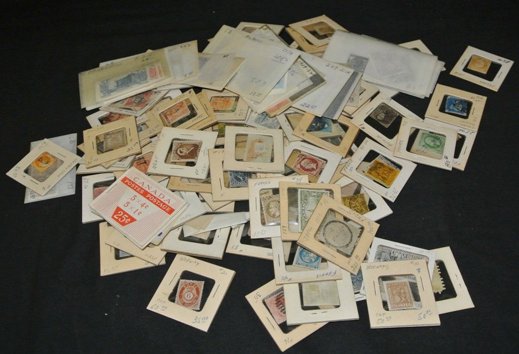 Worldwide Singles and Sets in Coin Holders: Interesting presentation of mostly higher catalog British and worldwide stamps in coin holders. I guess this dealer saw an advantage of being to see both sides with a simple flip. Loaded with $10-50 s