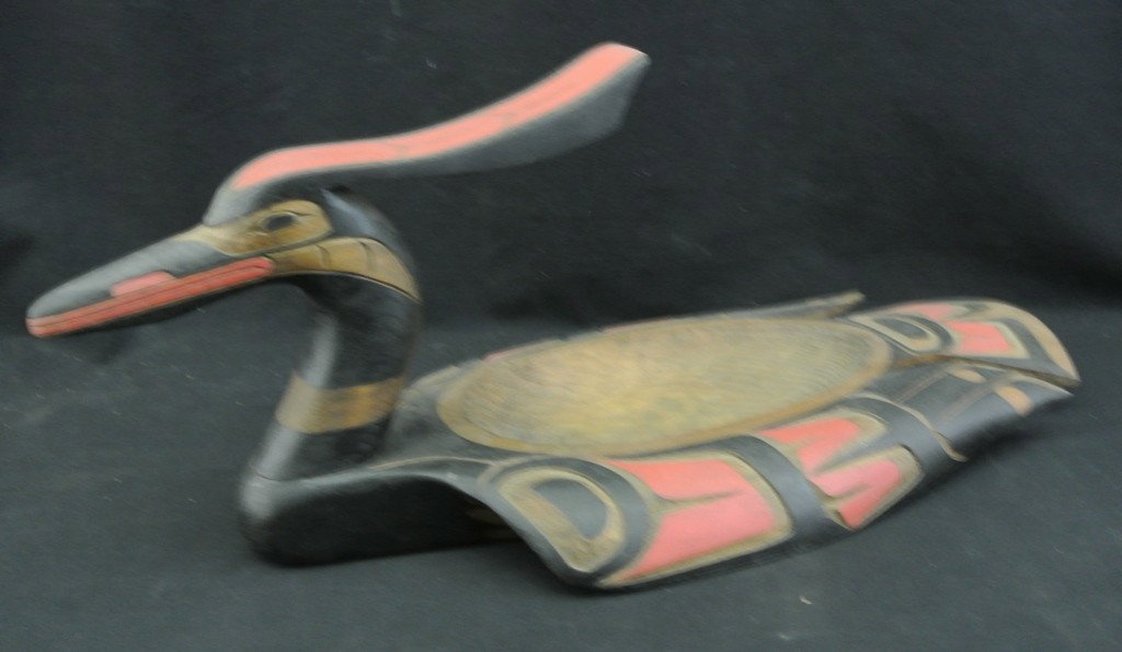 Northwest Coast Carved Loon Totem Feast Bowl by Do: Northwest Coast Carved Loon Totem Feast Bowl by Don McLeay. Beautiful carved and painted bowl signed and dated 1982 on the bottom. Measures 21 ¼” long x 9” wide x 9” high. A fantastic piece of 