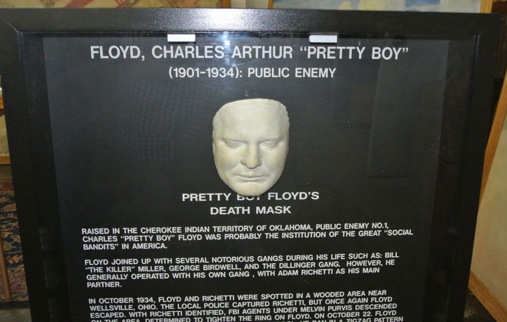 Pretty Boy Floyd Cast Death Mask Display: Incredible death mask of the of most notorius gangsters of the eary 20th c. Plasted cast mounted in a 33x34" case which stands on a pedastal making the entire piece 40" tall.