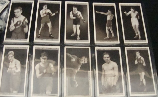 1928 Ogden's Pugilists in Action Complete Set: 1928 Ogden's 'Pugilists in Action' Complete 50-Card Boxing Set; beautiful set; overall condition is EX to EX-MT with some variation; no significant creases or stains; outstanding rarely seen full set 
