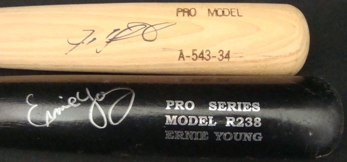 Ivan Rodriguez, Ernie Young Autographed Bats: Lot of (2) Autographed Bats; includes a natural colored Akadema Pro Model A-543-34 model bat measuring approx 33.5" in length - signed by Ivan Rodriguez on the barrel in black marker - comes with a JS