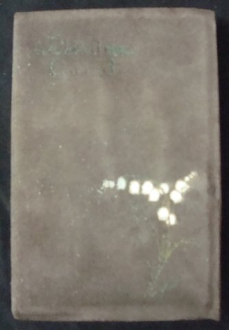 A Christmas Carol” by Charles Dickens: “A Christmas Carol” by Charles Dickens and illustrated by Frederick Simpson Coburn, Platt & Peck, in original presentation box. This suede covered soft bound book has a green title and white lilie