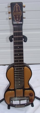 Bronson Melody King Steel Lap Guitar w Case: Made by Rickenbacher, refered to as their Model 52, with original case,appears to be in very good overall condition. 30" long, body 14" wide.