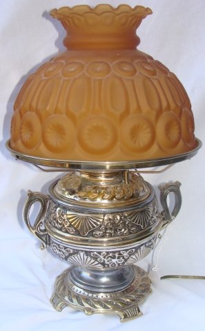 Rayo Converted Oil Lamp w Amber Shade: Stunning Embossed Lamp, with Original Amber Shade, Overall Height is 16 1/2" , Shade is 7" tall and 9 7/8" across. Base is 6 3/4" across and it is 8 1/2" from Handle-to-Handle, some loss to the finish