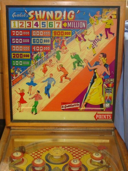1953 Gottlieb Shindig Woodrail Pinball Machine: 1950's Shindig Woodrail Machine, Working condition, has not been serviced and contacts could use a cleaning, known that one contact has some issues. 1200 produced, 8 trap holes, reverse flippers.Artwo