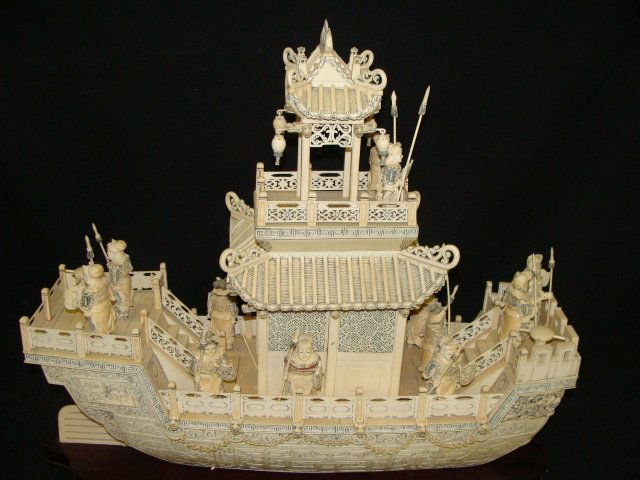 LIFES WORKED CARVED IVORY & BONE JAPANESE WAR BAR: 24" long, 20" tall 8" wide, base not included in measurements, 13 carved army figures, does have some damage, upper mast peg is broke from base and sail /mast has repairt, it appears some of the lante