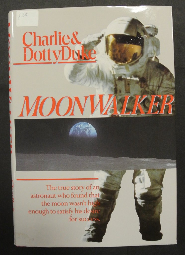 Charlie Duke Signed Moon Walker Hardbound Book: 1990 edition of Moon Walker, signed by Charlie Duke, the tenth and youngest astronaut to walk on the lunar surface of the moon. Signed on the title page.