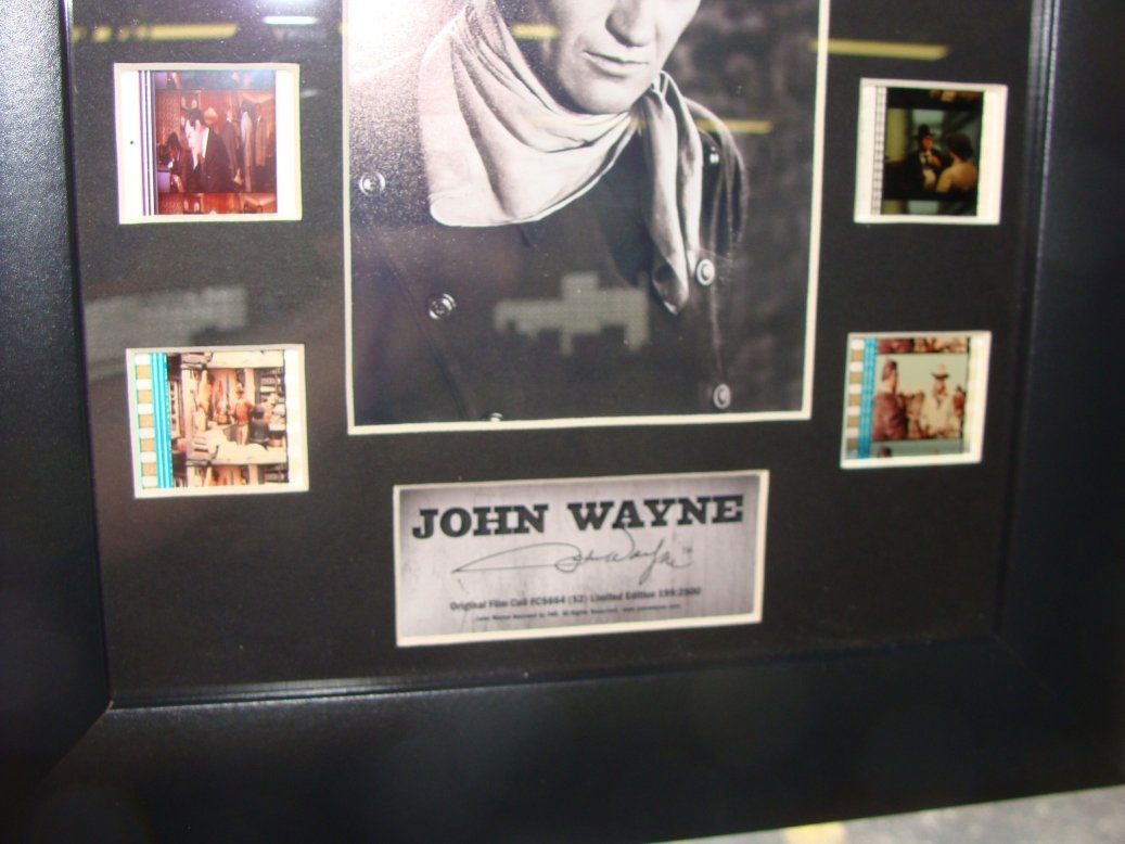 John Wayne Film Cell and Painted Dollar Collection: Includes a LE Film Cell framed piece and a set of a painted coins