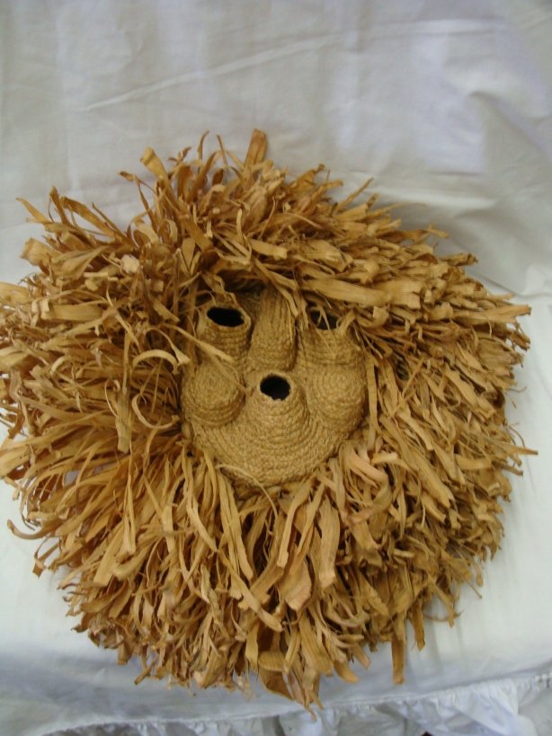 Mohawk Corn Husk Whistler Mask by Yvonne Thomas: Mohawk Corn Husk Whistler Mask by Yvonne Thomas. This mask is circa 1960's-70's and is in excellent condition. It measures approx. 17" x 20" and includes the original gallery tag. Value $350-$500