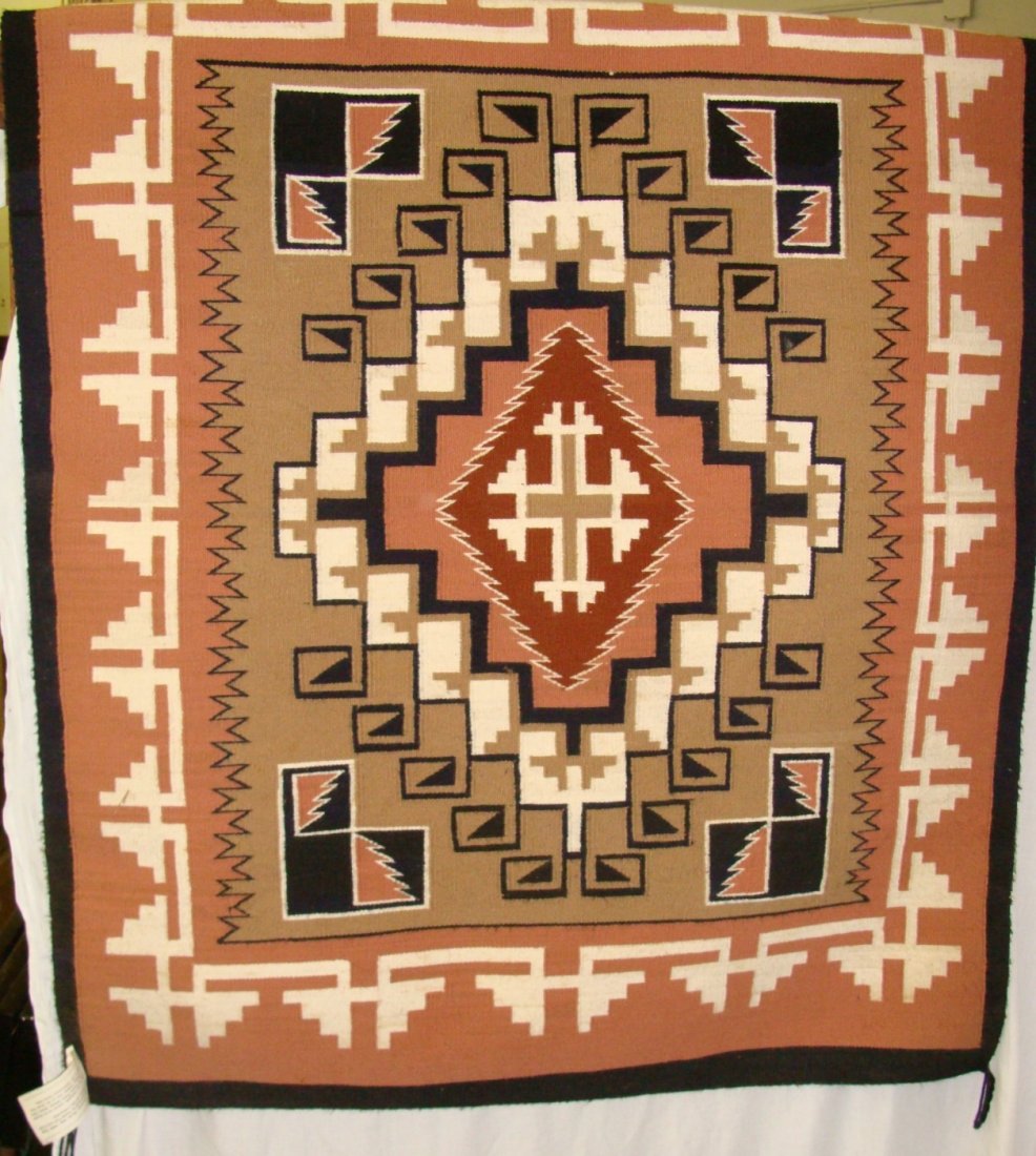 Lillie Begay Hand Woven Navajo Teec-Nos-Pos Rug: Hand Woven Navajo Teec-Nos-Pos Rug by Lillie Begay, 38" x 48", Made in 1976. This finely woven rug is 100% wool with natural and vegetable dyes. It has been hung on a wall so shows no wear. The origin