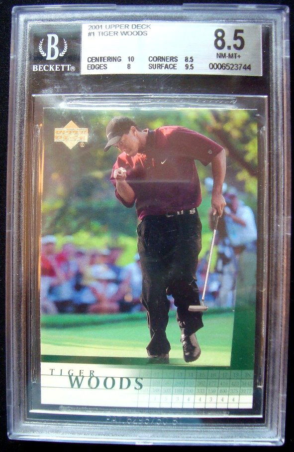 2001 Upper Deck #1 Tiger Woods Card, Beckett Graded: 2001 Upper Deck #1 Tiger Woods Card; Beckett Graded NM-MT 8.5; outstanding card featuring Woods at the height of his career in 2000 with (3) Major wins; great card for the Woods collector.
