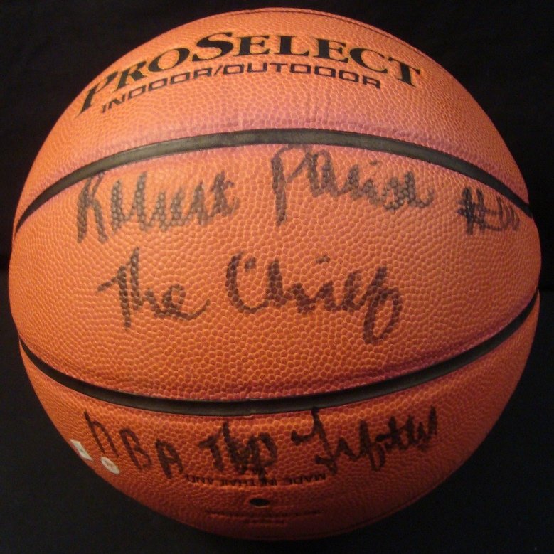 Robert Parish Signed and Inscribed Basketball, JSA: Robert Parish Signed and Inscribed Basketball; Official Wilson Pro Select Indoor/Outdoor ball signed by Parish in black sharpie marker with "#00 The Chief, NBA Top Fifty" inscription; comes with a JSA