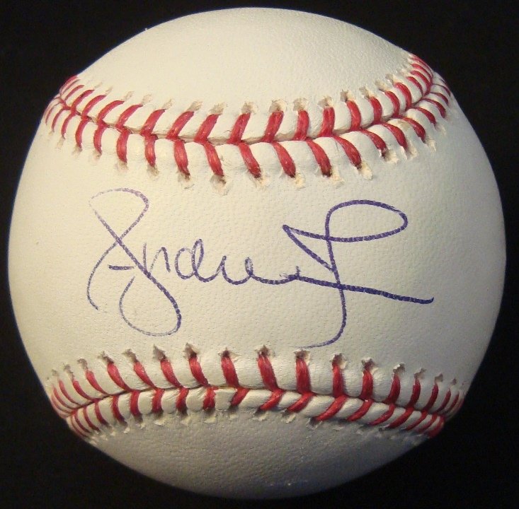 Andruw Jones Single Signed Baseball, JSA: Andruw Jones Single Signed Baseball; Official MLB Bud Selig ball signed by Jones on the sweet spot in blue ballpoint pen; good signature by the Golden Eagle; comes with a JSA Basic Cert #F11431.