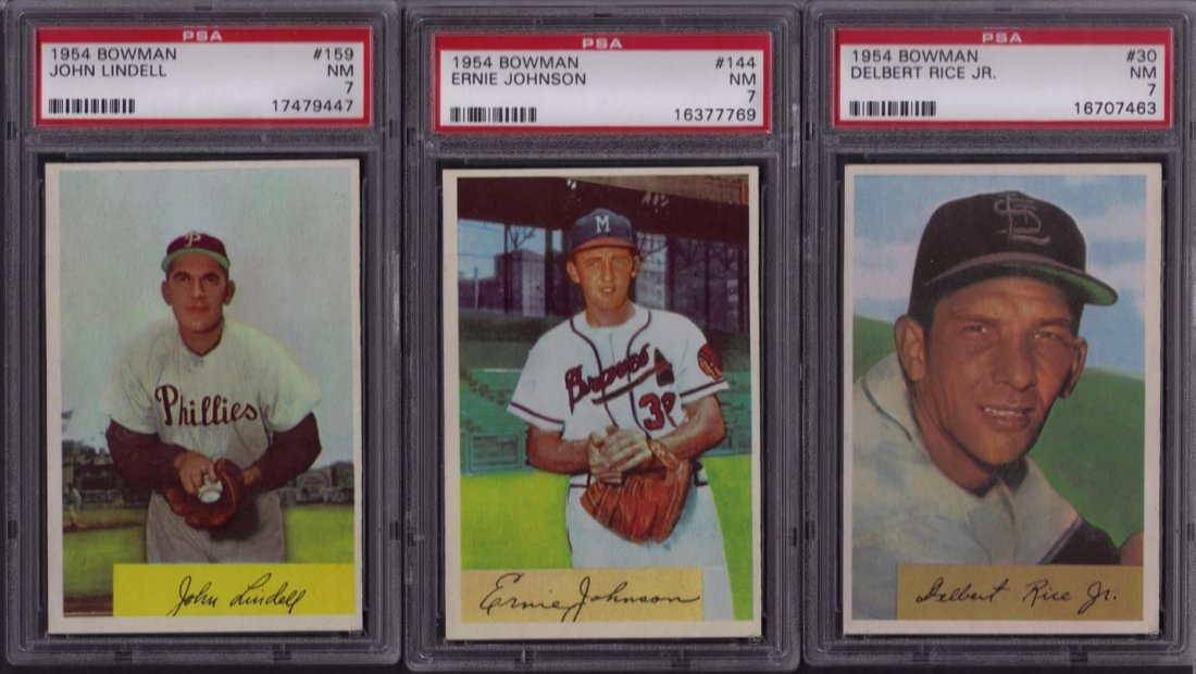 Lot of (3) 1954 Bowman Baseball Cards, PSA 7: Lot of (3) 1954 Bowman Baseball Cards; all graded PSA 7; includes #30 Del Rice, #144 Ernie Johnson RC and #159 John Lindell; all have nice coloring, centering and sharp corners; nice group.