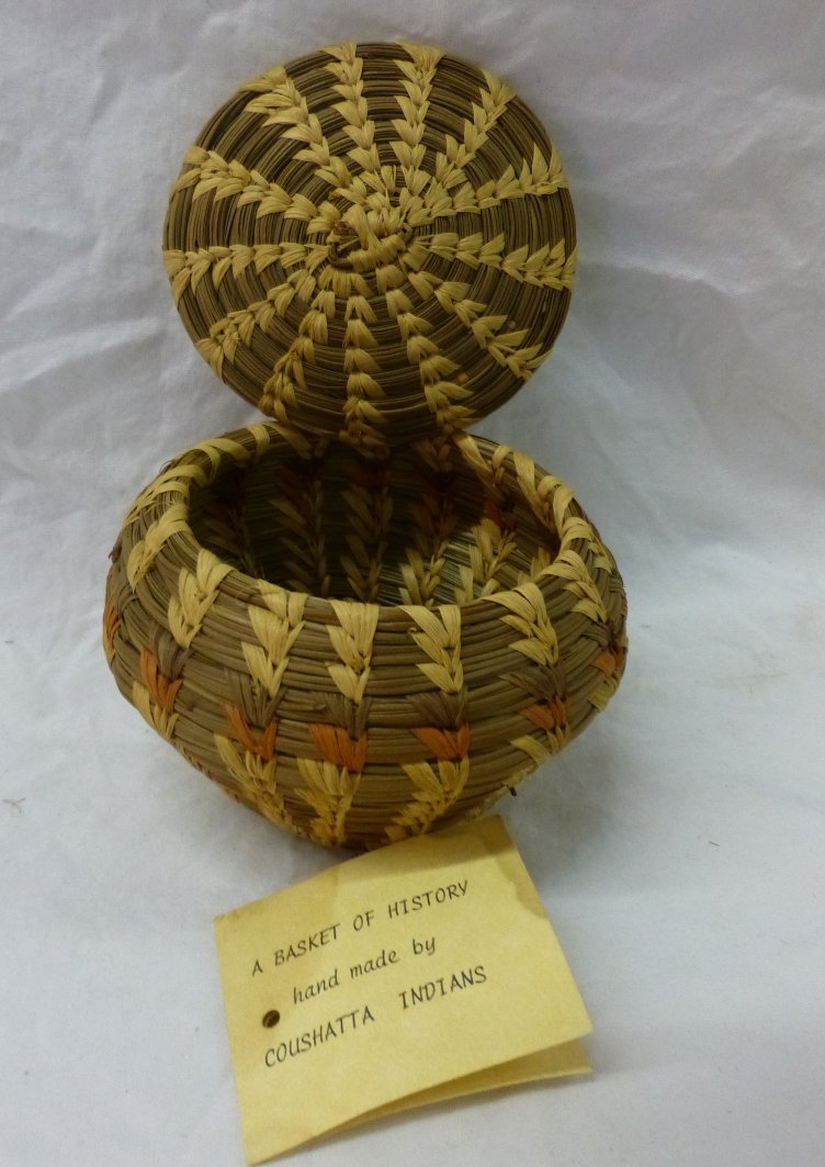 Coushatta Indian Pine Needle Basket & Lid E. Sylestine: Coushatta Indian Pine Needle Basket with Lid by E. Sylestine. Measures 3.5” high x 4” in diameter. Excellent condition with original tag. Value $40-$60.