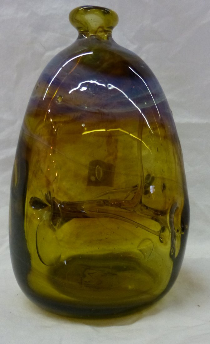 Blown Amber Swirl Glass Vase by Ojibwa Michael: Blown Amber Glass Vase with Green Swirls by Ojibwa Artist Michael Robinson (1948-2010). Measures 5.5” tall x 3.75” wide and is signed “Two Rivers”.