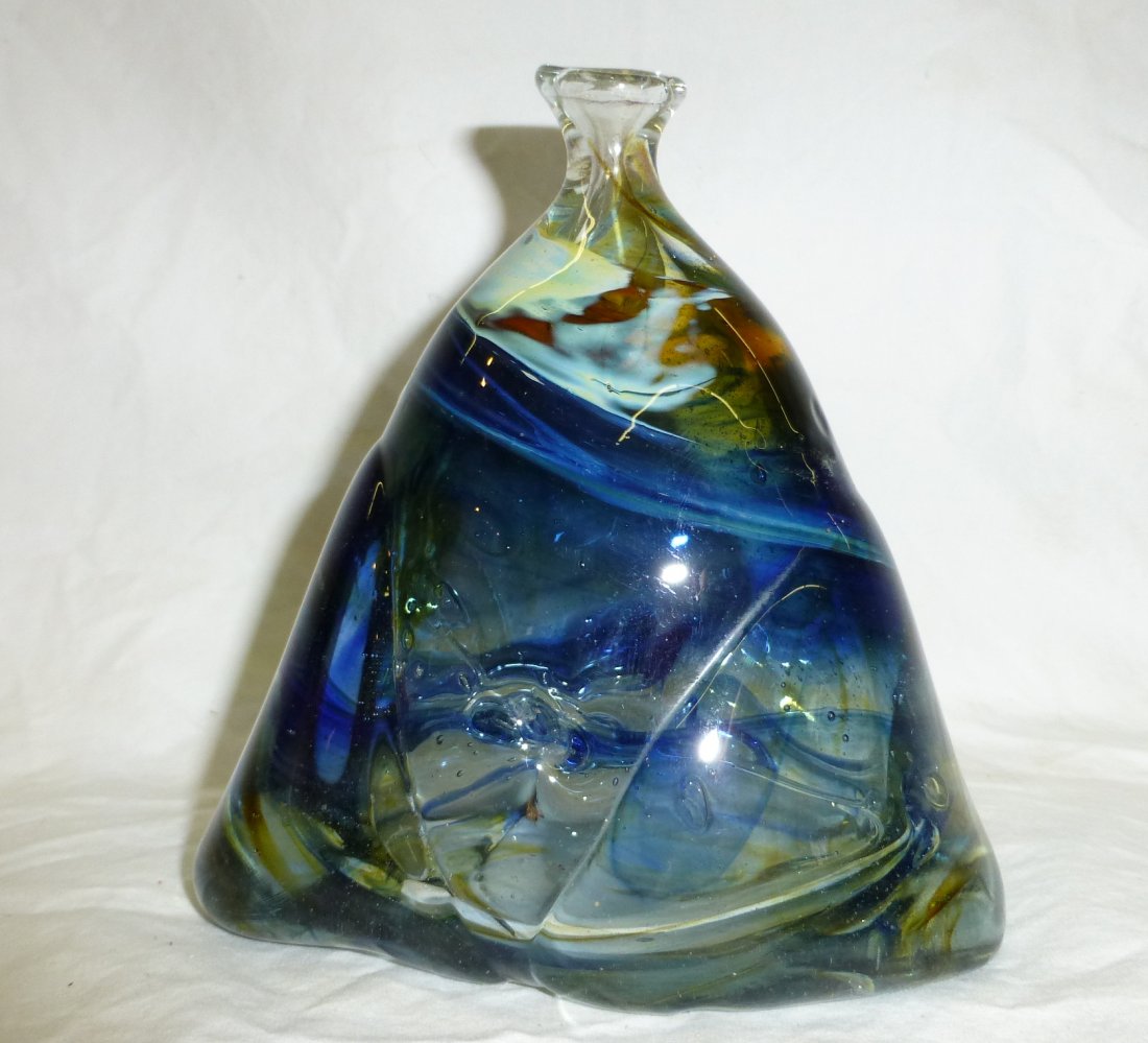 Blown Glass Vase by Ojibwa Michael Robinson: Blown Blue Glass Vase with Green Swirls by Ojibwa Artist Michael Robinson (1948-2010). Measures 5.5” tall x 5.5” wide and is signed “Two Rivers”.