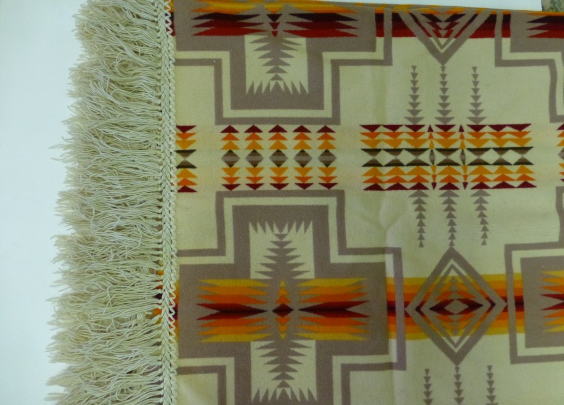 Beaver State Indian Robe Pendleton Woolen Mills: Beaver State Indian Robe from Pendleton Woolen Mills. This robe features beautiful geometric designs and fringe on all 4 sides. Excellent condition. Measures 65inches x 65 inches. Value $125-$150