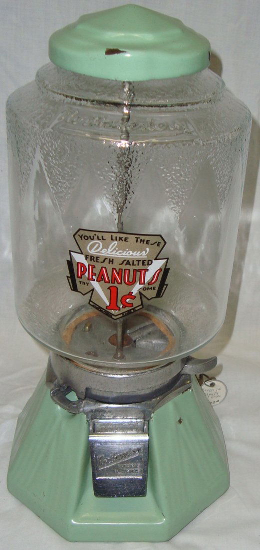 Antique Northwestern Light Green Art Deco Peanut: Penny Machine, Mechanism works and comes with keys. Original Northwestern glass, paint chipping on top 7 1/2"w X 7 1/2"d X 15 1/2"h