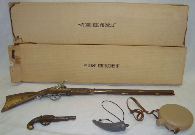 Daniel Boone Wilderness Set Plastic Toy Set Cap Gun: Daniel Boone Wilderness Set Plastic Toy Set Cap Gun. Set is in the origianl box, Box has slight water damage. In the Photos one set is open, one set is sealed (THIS AUCTION IS FOR THE OPEN SET)