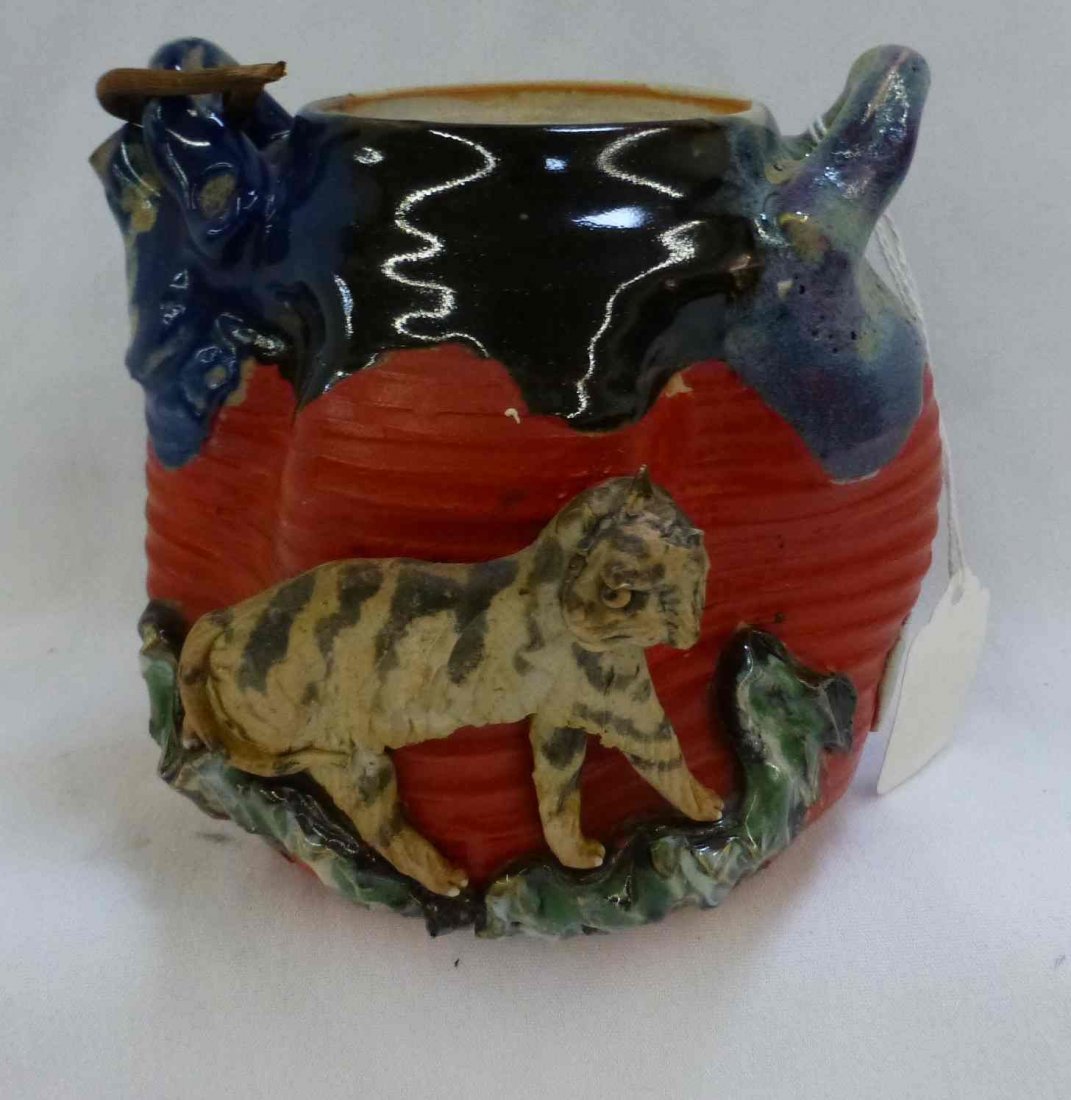 Signed Japanese Sumida Gawa Tiger Teapot High Relief: Artist emblem on piece, 5 1/2" tall, 5 1/2" wide, Lid present does have a chip in it.