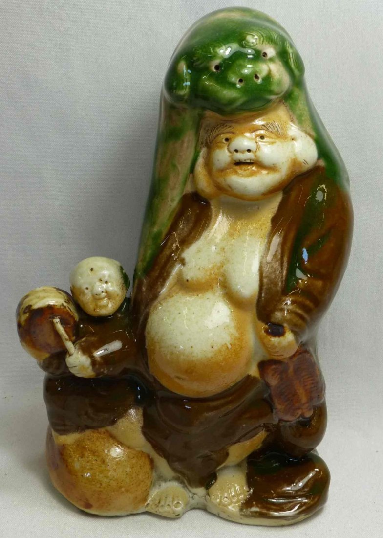 Odd Bisque Figurine Man Wearing a Seal Coat: Interesting Figurine 7 1/2" tall, heavy Bisque