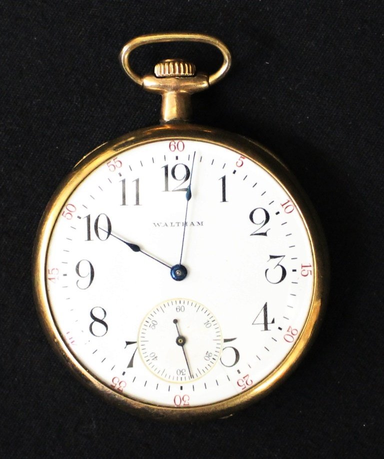 Waltham Pocket Watch: Clean, clasp back Waltham pocket watch. Gold wash case, 20 year guarantee. Serial #17980999. Runs well. Suggested bid $100
