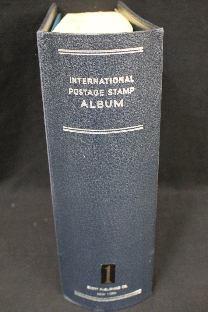 Used But Useful Scott International Volume One: Scott International Volume One 1840-1940 album with pages complete for countries A-Z. Very light use so there are not many previously hinge marks. About 700 stamps are here but the real value is in th