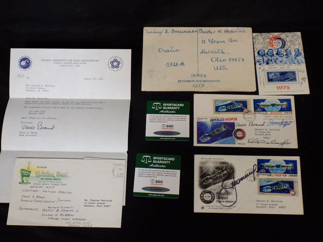 1975 Apollo Soyuz USA/Russia Space Mission: 1975 Apollo Soyuz USA/Russia Space Mission Astronaut/Cosmonaut Signed First Day Covers. One Cover has USA Astronauts Autographs of Tom Stafford, Vance Brand & Donald 'Deke' Slayton. Other Cover has Co