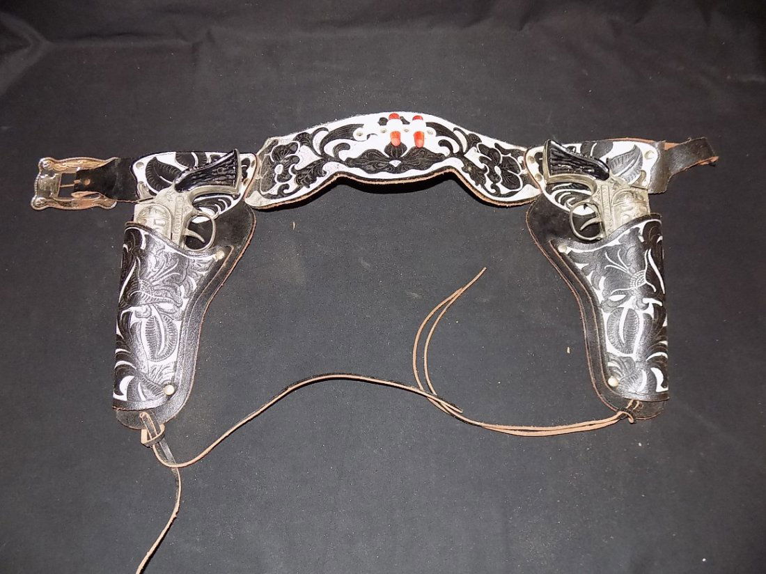 Vintage 1950's Cowpoke Jr Double Toy Cap Guns Set: Vintage 1950's Cowpoke Jr Double Toy Cap Guns Set W/Holster. Triggers work and 'snap'