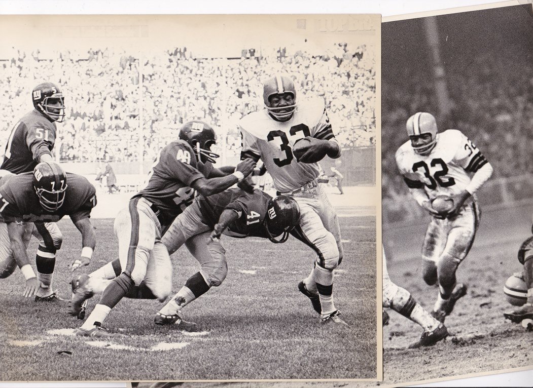 1950's Jim Brown 8x10 Real Photographs by Cecil Layne: 1950's Jim Brown 8x10 Real Photographs by Cecil Layne; an absolutely dynamic pair of photographs taken of Cleveland Browns star, Jim Brown, in action on the field; each measure 8x10 and are printed in