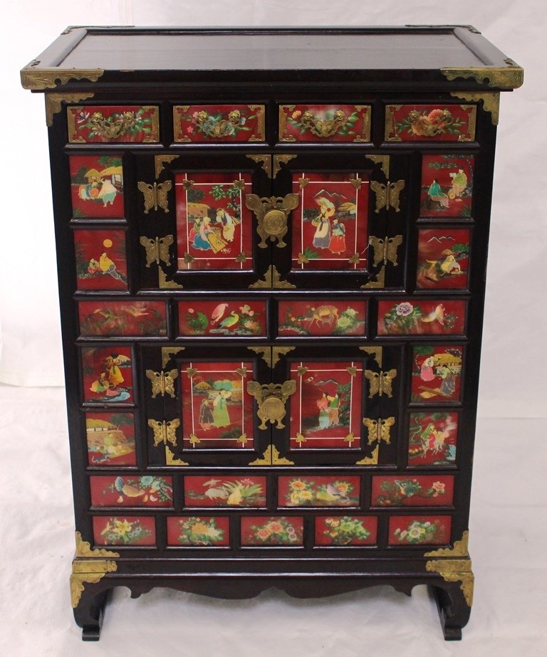 Korean Medicine Cabinet: Mid 20th c. Korean Medicinal Cabinet. The piece stands 34" tall by 25" wide by 16" deep. It appears be made from mahogany and then lacquer to appear as rosewood. Four small drawers at top with two lar