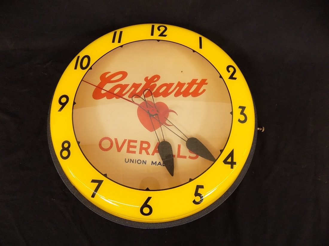 Antique 16" Neon Clock Carhartt Overalls: Antique 16" Neon Clock Carhartt Overalls made by Neon Products Inc. Clock has not been tested, cord has been cut.