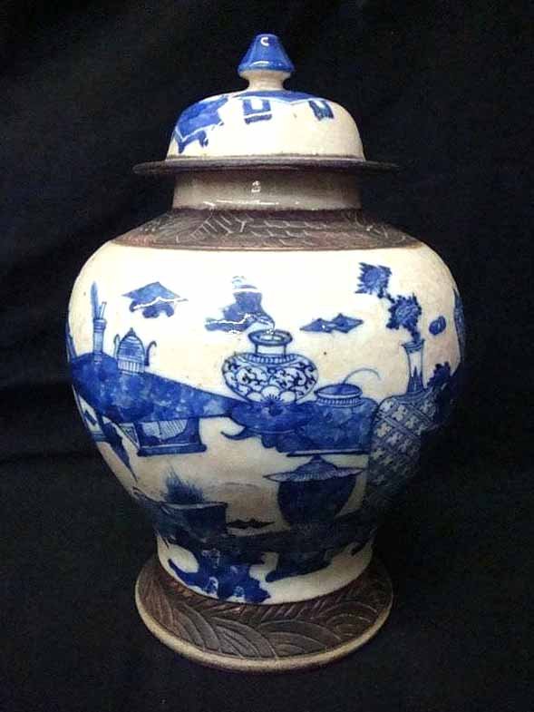 Qing Dynasty Enameled Clay Lidded Urn: Qing Dynasty Enameled Clay Lidded Urn. Dark blue enamel on light gray ground with incised pattern around base, top of urn and lid. 11" tall, 7" diameter. Heavy crazing.