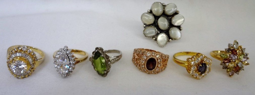 (7) Sterling Silver and Gemstones Ladies Rings: (7) Sterling Silver and Gemstones Ladies Rings: Sizes include (3) 8, 8.75, 8.5, 7, 9. All diamond like stones are Cubic Zirconias. Beautiful sterling rings, and in pictures the gold is gold plated ste