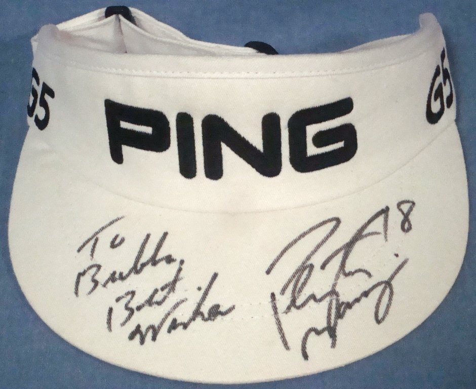 Peyton Manning Signed and Inscribed PING Golf Visor: Peyton Manning Signed and Inscribed PING Golf Visor; PING G5 white golf visor covered in large lettering on the top of the bill by famed Quarterback, Peyton Manning; signed in black fiber tip marker i