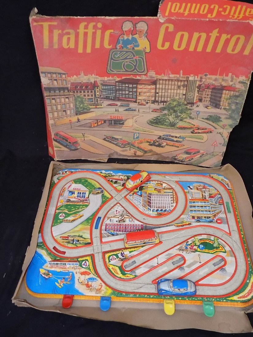 1950's Traffic Control 3 Car Tin Litho Game by: 1950's Traffic Control 3 Car Tin Litho Game by Technofix Model 295 Original box is present but not in the best condition Key is not present to test the cars