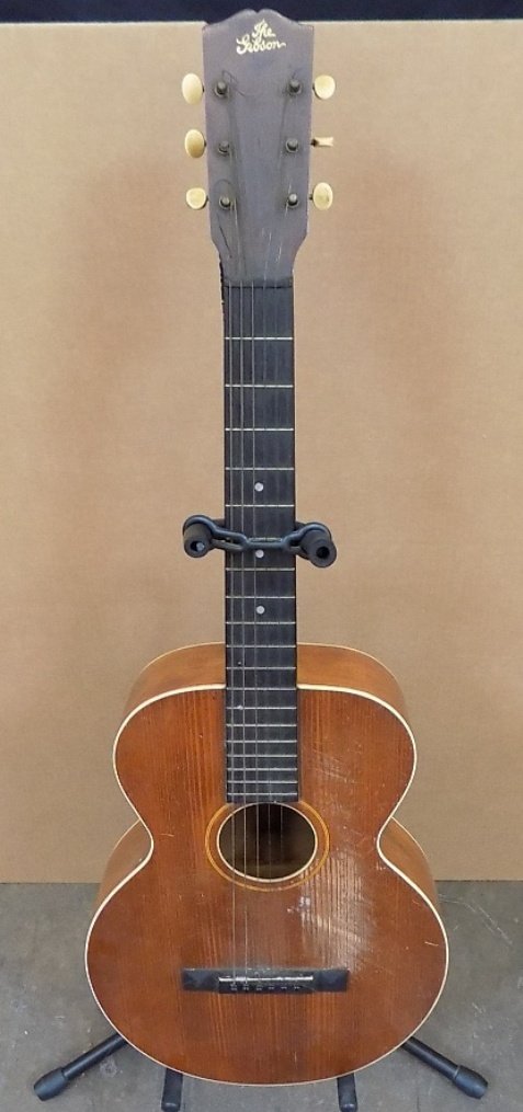 EARLY GIBSON L0 Flattop ACOUSTIC GUITAR s/n 8285 1909: EARLY GIBSON L1 Flattop ACOUSTIC GUITAR 6 String guitar Marked 'The' Gibson on the top. s/n 8285 1909 serial number is stamped inside by neck