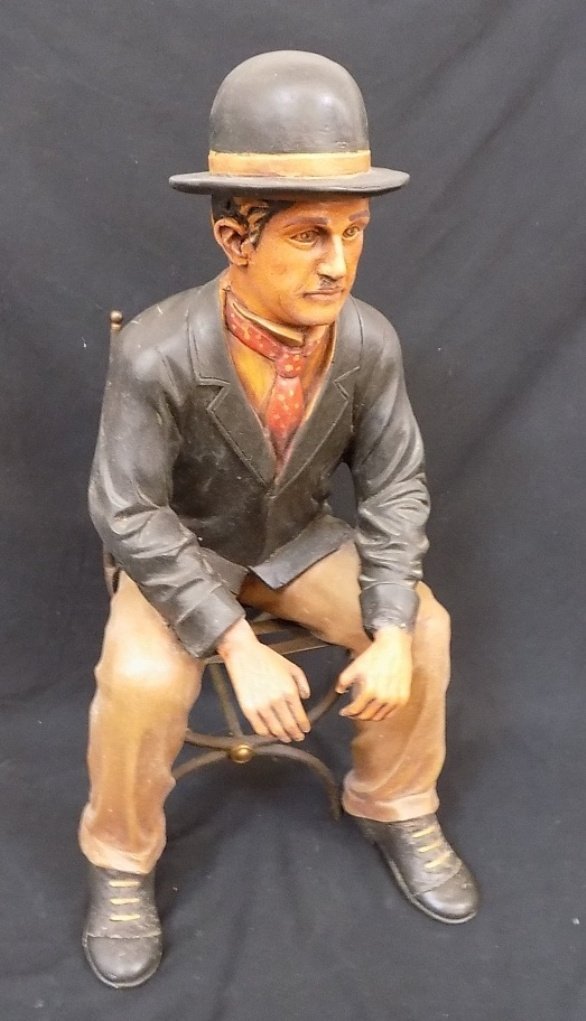 25" Tall Charlie Chaplin Painted Molded Plastic figure: 25" Tall Charlie Chaplin Painted Molded Plastic figure Sitting on a Metal Chair 13" wide.