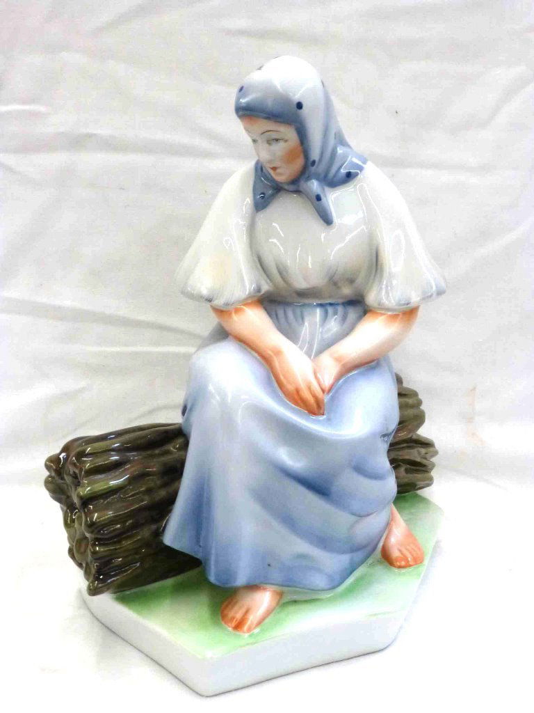 Zsolnay Folk Woman on Log: 10" tall x 10" wide, no issues to report, marked on the bottom.